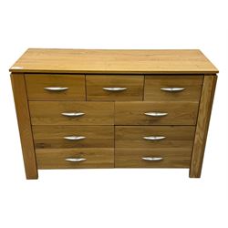 Contemporary light oak sideboard, rectangular top over three short and six long drawers each fitted with chrome handles, on plinth base