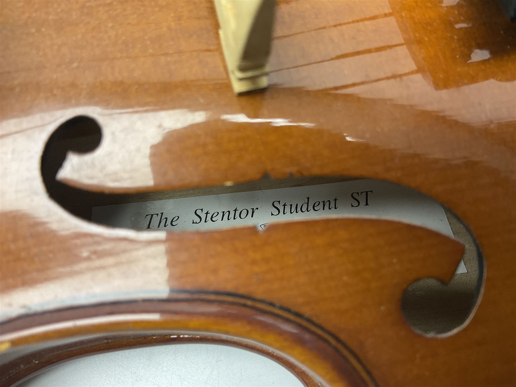 Three Stentor Student violins - three-quarter size with 33cm two-piece back; and two quarter size each with 28cm two-piece back; each in carrying case with bow (3)