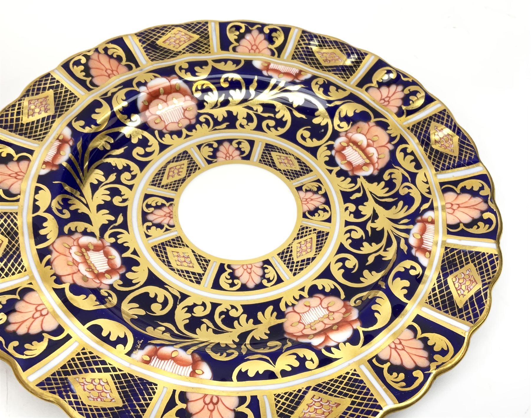 A pair of early 19th century Spode Imari 1823 pattern plates, D19cm, together with two Royal Crown derby Imari 1128 pattern plates, D16cm, and a Crown Derby A962 pattern twin handled open tureen, not including handles D28.5cm. (5). 
