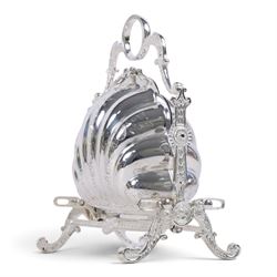 Silver-plated Victorian style biscuit box, in a shell form with engraved leaf detailing, upon scroll feet, H24cm