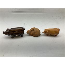 Group of ten Japanese netsukes, comprising eight carved wooden examples, and two ivorine examples, of various form, examples modelled as pigs, owl, mouse with tortoise upon its back, birds, rabbit, etc. 