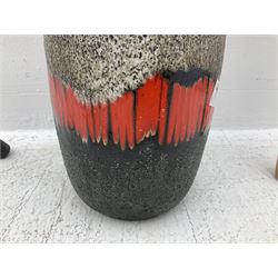 Two smooth polished ram horn handled Shepherd's crooks and a further similar example, together with various shooting sticks, walking sticks and canes, housed in a volcanic lava glaze West German style vase