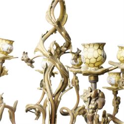 Rococo design brass ten light chandelier with scroll branches and ceramic candle holders H74cm
