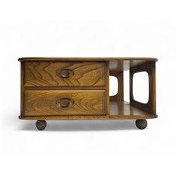 Lucian Ercolani for Ercol - elm 'Pandora's Box' coffee table, square top with rounded corners over two drawers with sculpted recessed pulls, open sides supporting undertier, on castors 