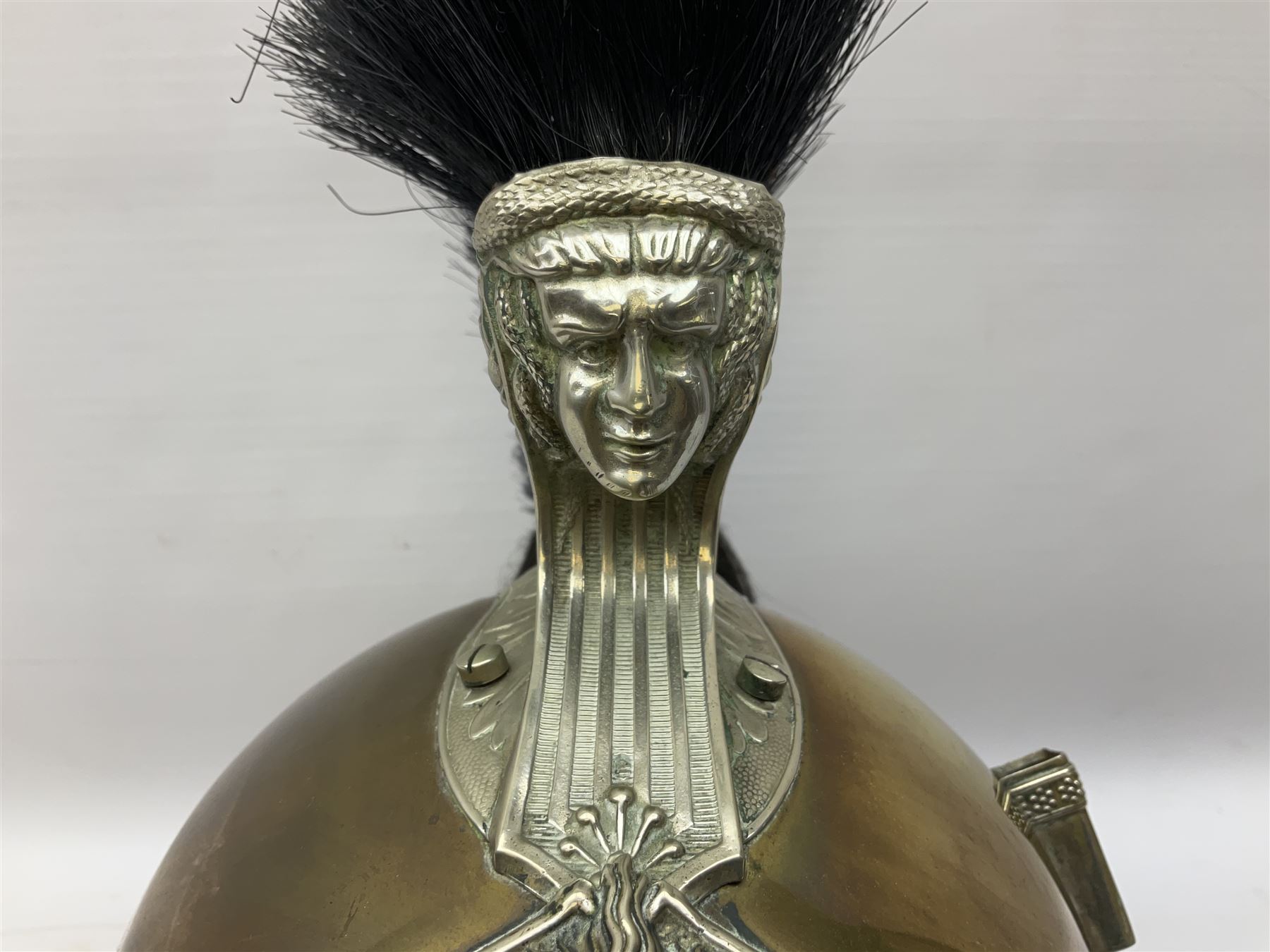 French Model 1913 mounted gendarmerie helmet; brass bodied with nickel mounts, chin strap, comb and horse-hair H27cm (no liner)
