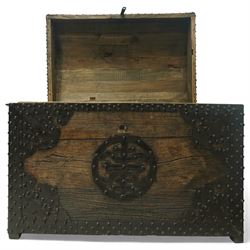 20th century Chinese camphorwood chest, the hinged lid opening to a plain interior, the exterior fitted with heavy iron strapwork, studded mounts and shaped corner plates, central circular lock escutcheon, with iron carrying handles