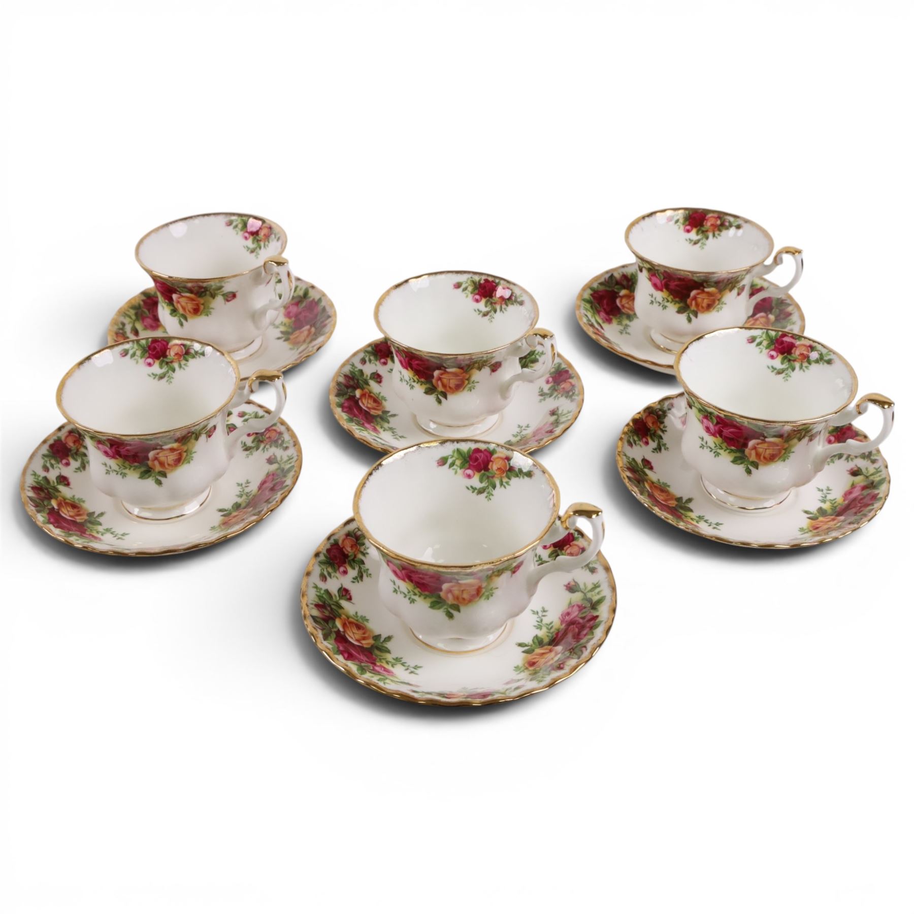 Royal Albert Country Rose tea service for six, comprising teapot, milk jug, covered sucrier, dessert plates, two sandwich plates, cups and saucers 