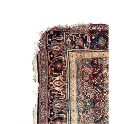 Persian Herati red ground rug, the field decorated with repeating motifs, guarded patterned border