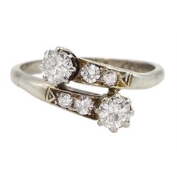 Early 20th century white gold old cut diamond crossover ring, with diamond set shoulders, stamped 18ct Plat, principle diamonds approx 0.20 carat each, total diamond weight approx 0.50 carat