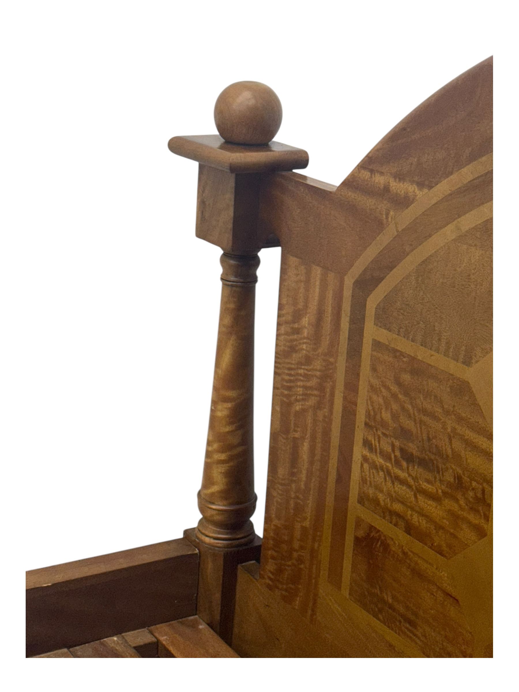 Contemporary mango wood bed frame, comprising an arched panelled headboard and footboard with inlaid geometric patterns, turned posts with spherical finials, and complete with side rails and slatted base