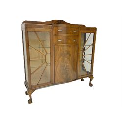 Mid-20th century Art Deco style walnut display cabinet, two central drawers over cupboard flanked by two bevel glazed display cabinets with sunburst astragal glazing, on ball and claw cabriole feet