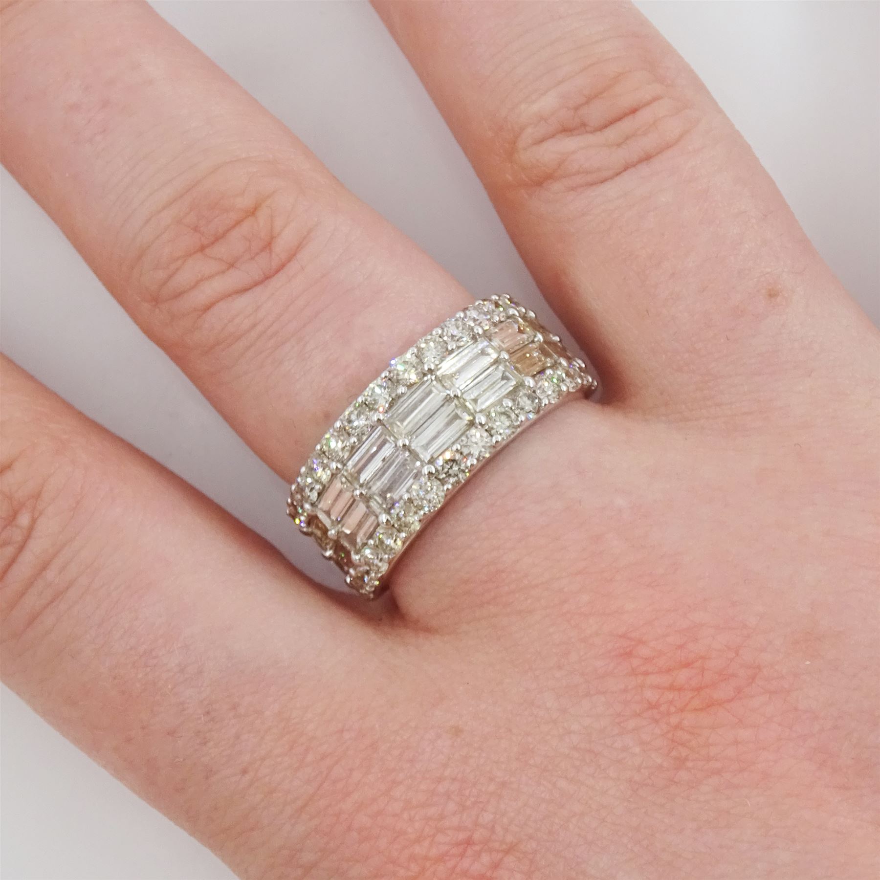 White gold four row, round brilliant cut and baguette cut diamond ring hallmarked 9ct, total diamond weight 2.72 carat 