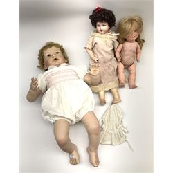 A modern ceramic head doll, with 'TA7703' and impressed signature to back of head, together with two other dolls. 