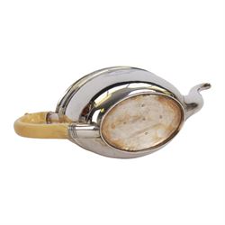 George III silver three piece tea service, comprising teapot with ivory scroll capped curved handle and ivory finial to the hinged cover, twin handled open sucrier with gilt interior, and cream jug with gilt interior, each of oval form with rounded sides, the bodies engraved with central monogram within a seaweed wreath, between engraved foliate bands, hallmarked John Emes, London 1801, teapot including handle H17cm

This item has been registered for sale under Section 10 of the APHA Ivory Act