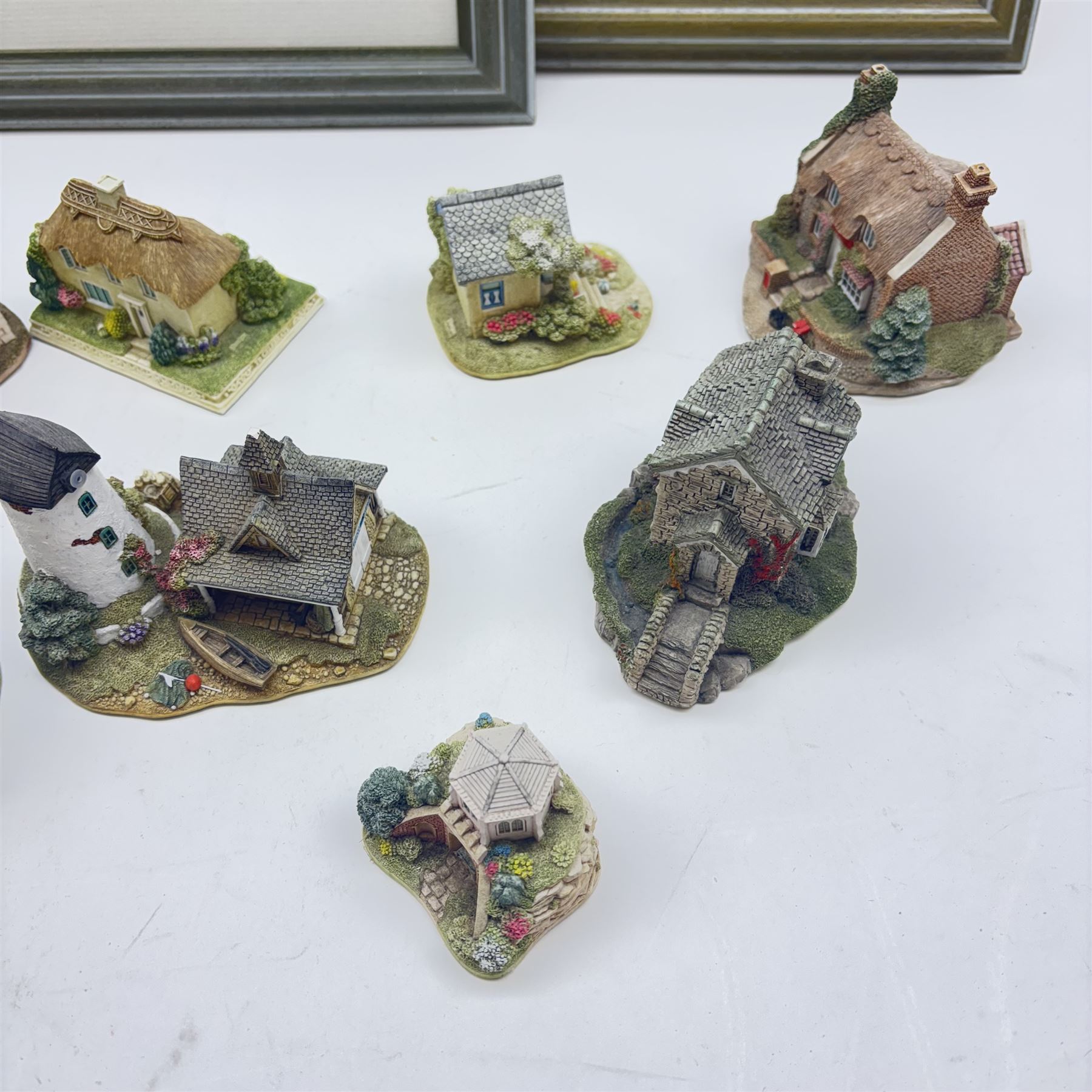 Eighteen Lilliput lanes, including Lundy Lighthouse, Bluebell Wood, St Marys, Winsor Cottage etc, all with original boxes and four limited edition Lilliput Lane prints 