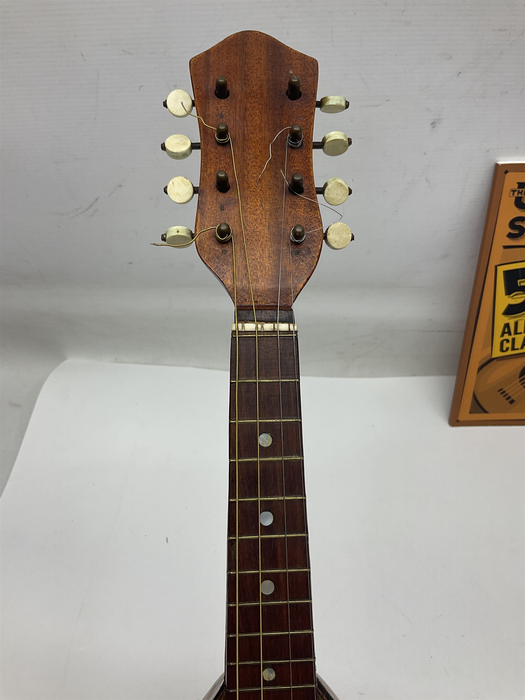 W.D. Keech banjolele pat.219720/23 with etched signature to the back; serial no.A12082 L55cm; and a restored Italian mandolin with segmented lute back; together with three music books