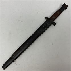British Pattern 1888 knife bayonet, the 30.5cm double edged blade with raised central medial ridge; in leather covered scabbard L40.5cm overall