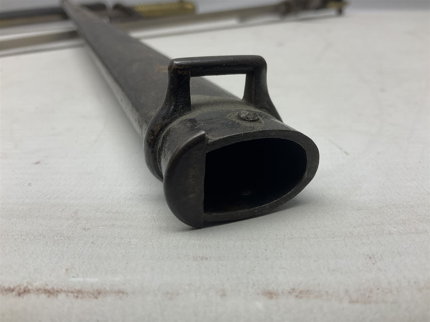 French Model 1866 Chassepot bayonet with 57cm curving fullered steel blade dated 1873 No.L63963; in steel scabbard with conforming number L71.5cm overall; and French St. Etienne Gras bayonet dated 1878 No.K10674 in steel scabbard numbered 79437 (2)