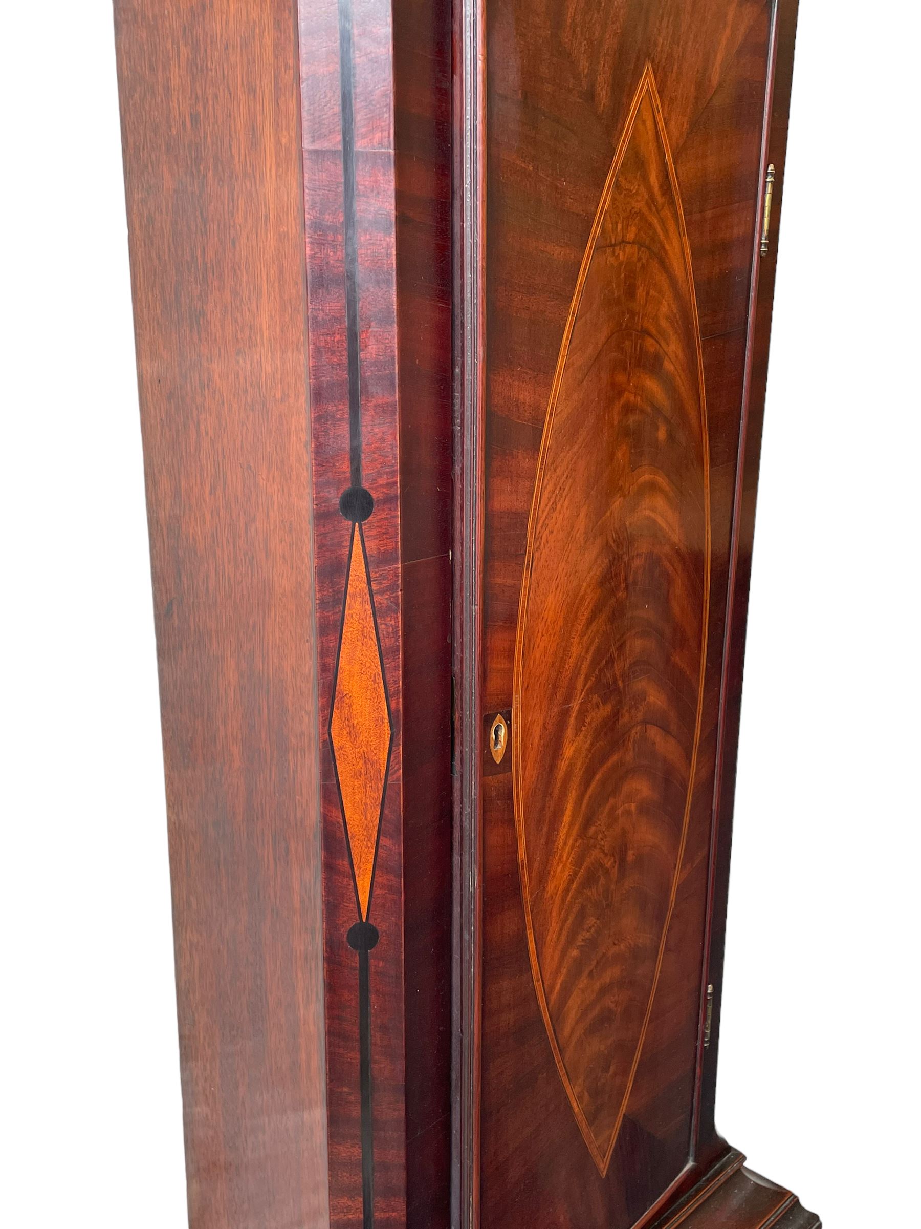 John Bancroft of Scarborough - a fine late George III 8-day mahogany longcase clock, with an elaborate pagoda pediment, brass ball and eagle finials and oval conch shell inlay, break arch hood door flanked by reeded pilasters with brass Corinthian capitals, trunk with inlaid canted corners and a break arch trunk door with 