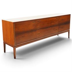 Robert Heritage (1927-2008) for Archie Shine - Large rosewood sideboard, with a central bank of three drawers flanked by a cupboard either side, raised on square tapering supports