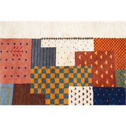 Persian style Gabbeh Loribaft design ivory ground rug, the vibrant field decorated with geometric patchwork design panels with interspersed stylised tree motifs, enclosed by a wide ivory guard band