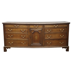  George III Lancashire oak dresser base, moulded top above nine drawers and cupboard door inlaid with fan, on bracket feet, W186cm, H81cm, D52cm  