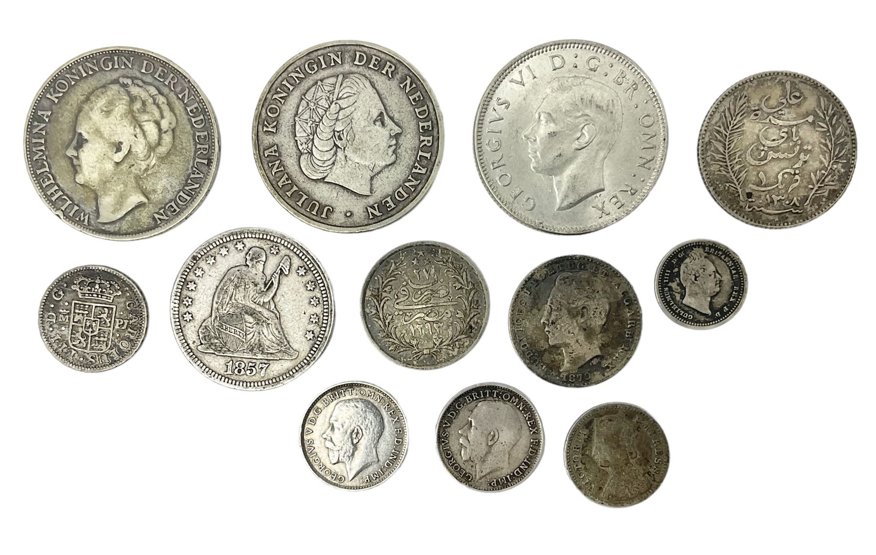 Twelve World coins, including William IIII United Colony of Demerary and Essequibo 1832 one eight guilder, United States of America 1857 quarter dollar, Tunisia 1891 one franc etc 