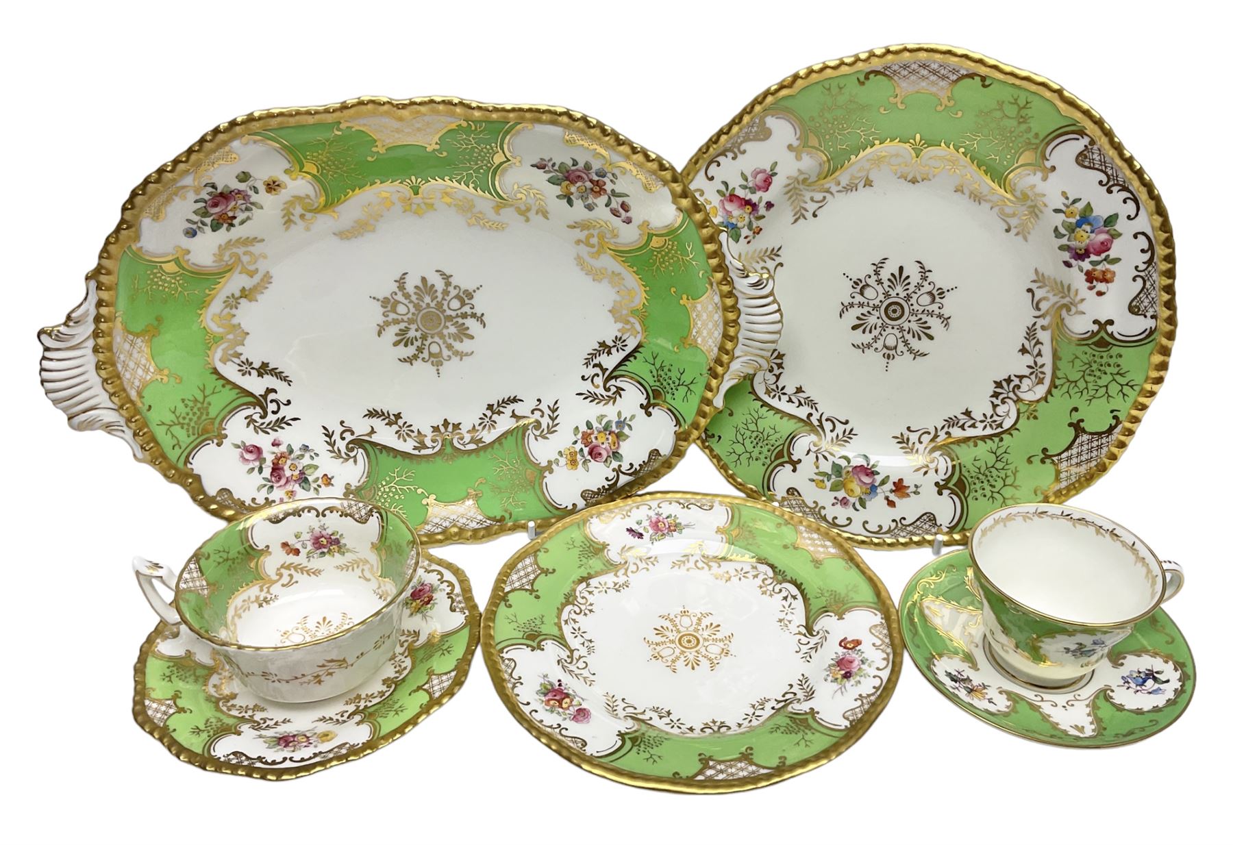 Coalport green batwing pattern tea wares, decorated with finely enamelled floral sprays within gilt reserves, comprising teacup trio, twin handled cake plate and side plate, pattern no Y2665, together with a Coalport for Harrods cup and saucer similarly decorated, the saucer with stamped mark beneath 'Manufactured for Harrods Ltd, Brompton Rd London', all with green Coalport AD 1750 marks beneath, largest W31cm (7)
