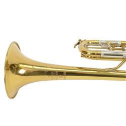Besson brass trumpet, with three piston valves and finger hook, heavily lacquered finish with mouthpiece, within a velvet lined hard case