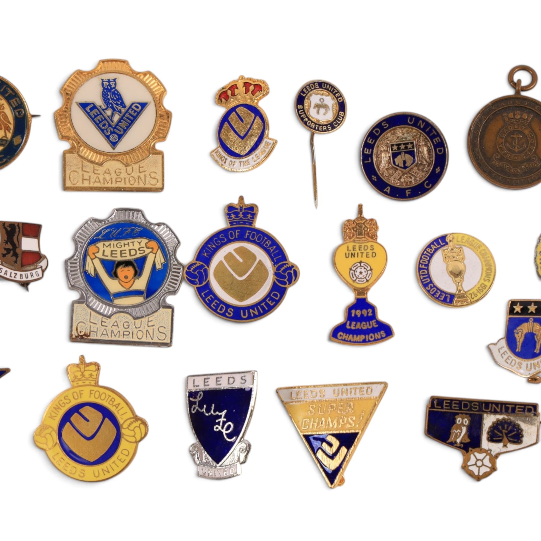 Collection of Leeds United enamel badges, including League Champions and League Winners examples, and a embroidered LUAFC patch