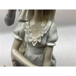 Lladro figure, My Wedding Day, modelled as a bride preparing for the ceremony with her mother adding flowers to her veil, sculpted by Jose Puche, with original box, no 1494, year issued 1986, year retired 1997, H38cm