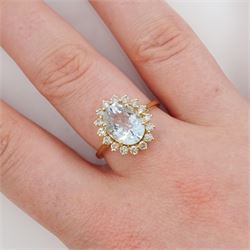 18ct gold oval cut aquamarine and round brilliant cut diamond cluster ring, stamped, aquamarine approx 2.20 carat, total diamond weight approx 0.50 carat