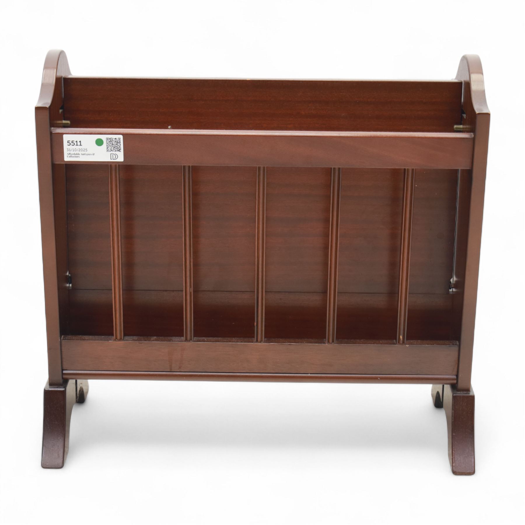 20th century mahogany magazine rack, with shaped ends and pierced divider slats, brass lion mask ring handles to each side, raised on splayed bracket feet