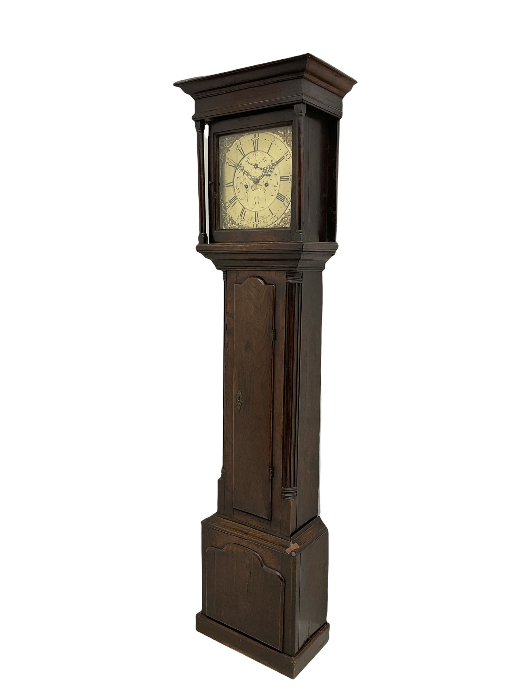 An 18th century oak cased longcase clock by M Thomas & Sons, Carnarvon c1780, flat topped hood with a wide cornice and plain frieze, glazed hood door flanked by two shaped pillars, with a long trunk and  door with a break arch top, with canted and reeded corners on a short plinth with a raised conforming break arch panel and skirting, 13” brass dial with an engraved centre,  small semi-circular date aperture and disc behind, with a subsidiary seconds dial, non-matching steel hands and scroll spandrels, Engraved chapter ring with roman numerals, five minute Arabic's and minute markers, dial pinned directly to an eight day rack striking movement, striking the hours on a cast bell. With weights, pendulum and key.    
Michael and Morris Thomas are recorded as working together in Carnarvon 1769-94.




