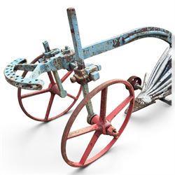 J. & F. Howard Ltd., Bedford - late 19th/early 20th century blue-painted cast iron horse-drawn potato ridger, with twin handles above a curved beam, adjustable ridging body and ploughshare, on red-painted five-spoke wheels, signed HOWARD BEDFORD