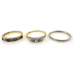  Gold three stone diamond ring stamped 18ct, white gold wedding band hallmarked 18ct and emerald and diamond ring hallmarked 9ct   
