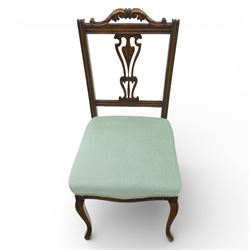Late Victorian mahogany side chair, the carved cresting rail above a pierced and carved splat with lyre-form detail, the back panel inset with cane work, drop-in upholstered seat in pale green fabric with braid trim, raised on cabriole supports