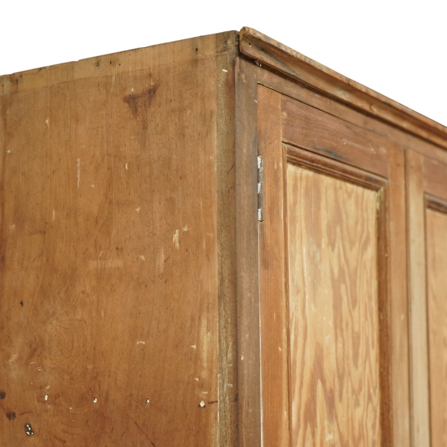 Early 20th century pine and beech kitchen dresser, projecting cornice above three panelled cupboard doors, base fitted with three drawers and twin panelled cupboards, on plinth base