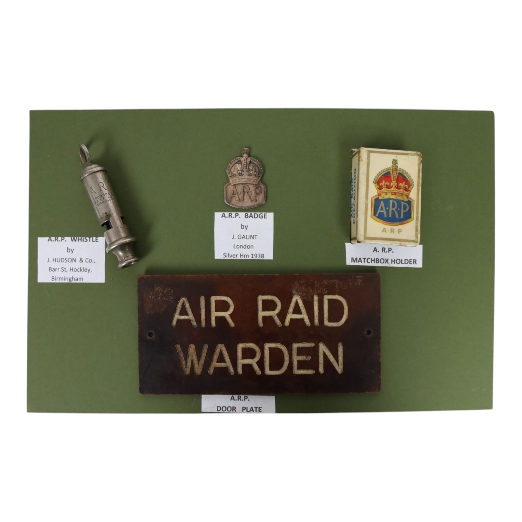 Air Raid Precautions items, including four door plates, silver lapel bedges, Women's Voluntary Service, whistle, matchbox etc  