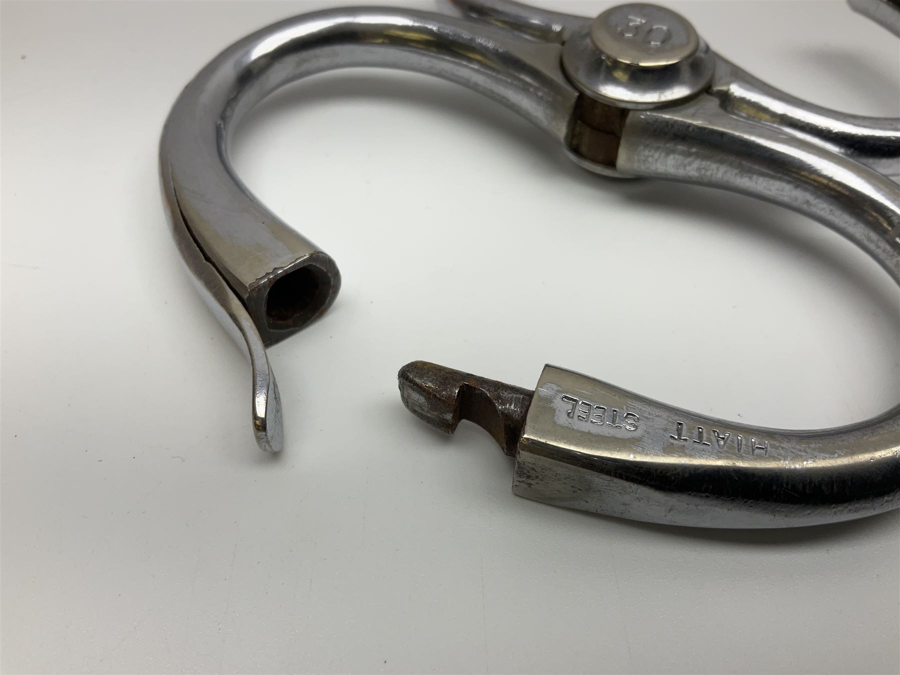 Police - two pairs of steel nipper handcuffs, one stamped Hull City Police; two other chromium plated Hiatt steel nipper handcuffs, each stamped HCP (?Hull City Police); and a pair of chromed steel articulated handcuffs stamped WRC (?West Riding Constabulary) (5)