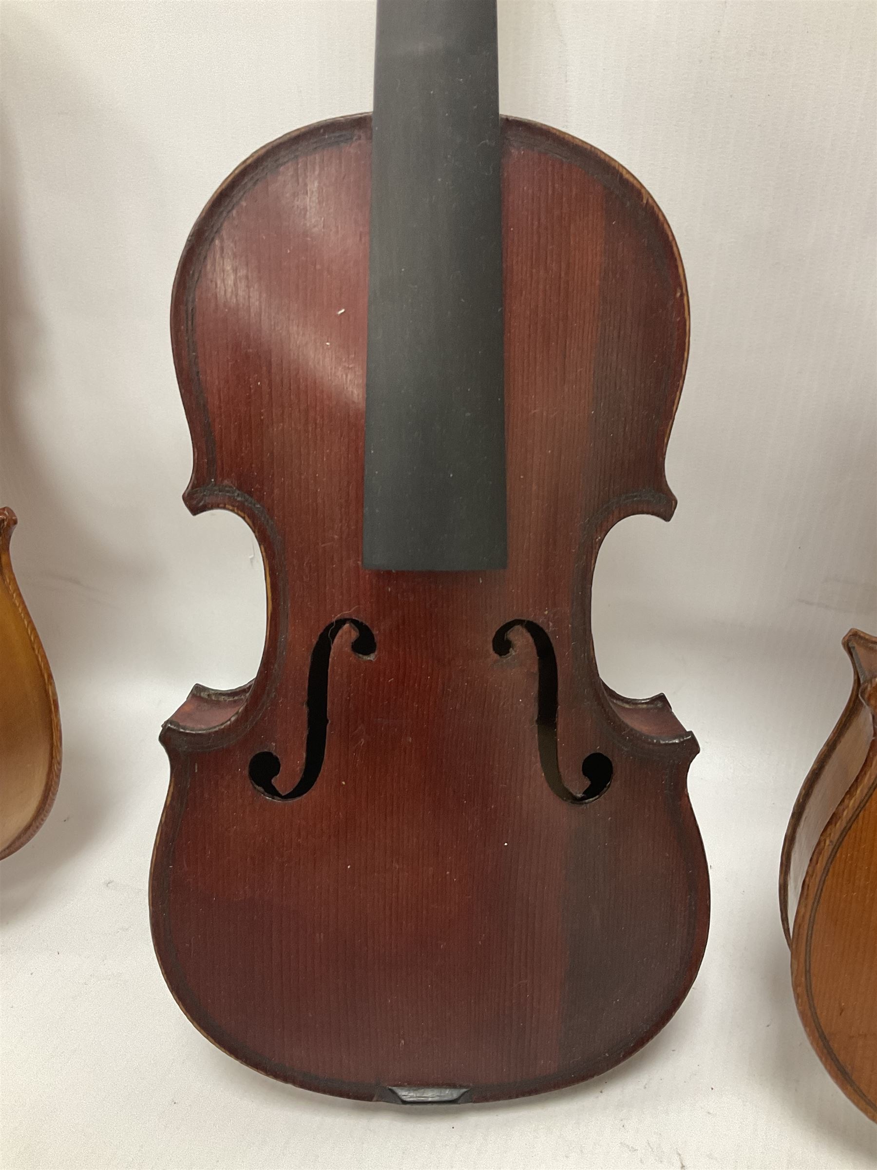 Four violins 1/8th size; half size with Nicolas Bertholini label; three-quarter size with Stradivarius copy label; and full size with Marquis De L'Air label (4)