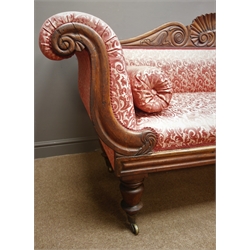  Victorian mahogany framed settee, shaped cresting rail with shell carving, scroll ends, upholstered in red floral fabric, turned supports, W225cm  