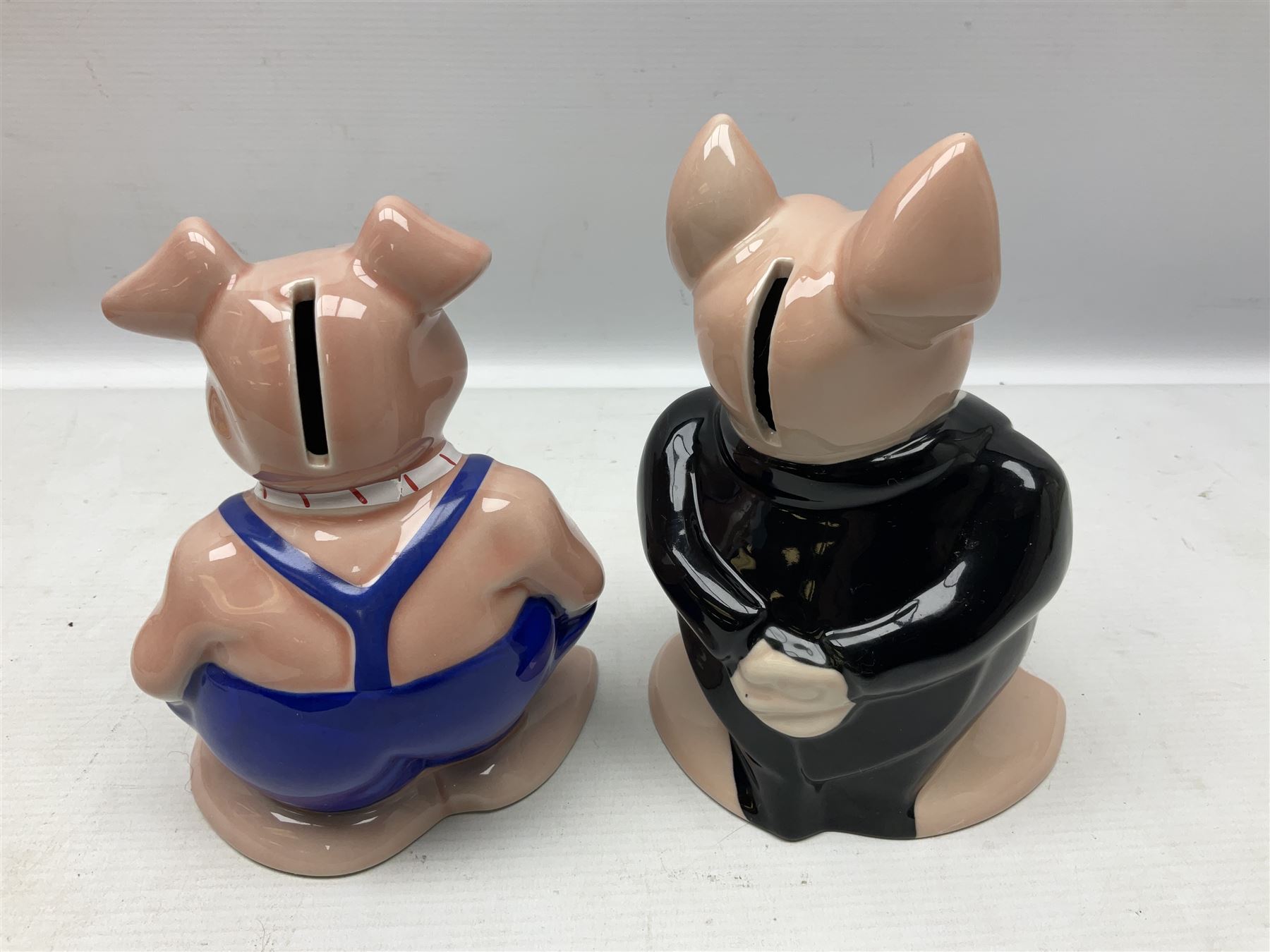 Set of five Wade NatWest money boxes, comprising father, mother, boy, girl and baby, four with original boxes 