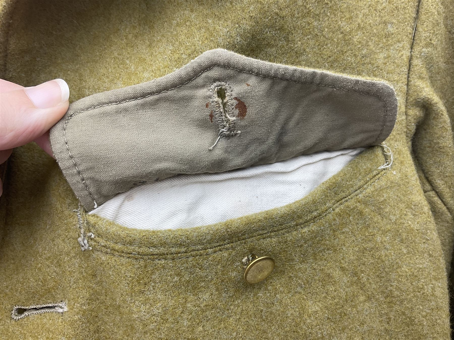 Japanese Type 38 winter tunic, the lining stamped with various Japanese character marks