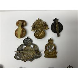 Nineteen Yeomanry metal cap badges including Derbyshire, Northamptonshire, Essex, Glamorgan, Staffordshire, City of London, Surrey, Shropshire, Hertfordshire etc; together with eleven Fusiliers badges including Lancashire, Royal Welch, Northumberland etc (30)