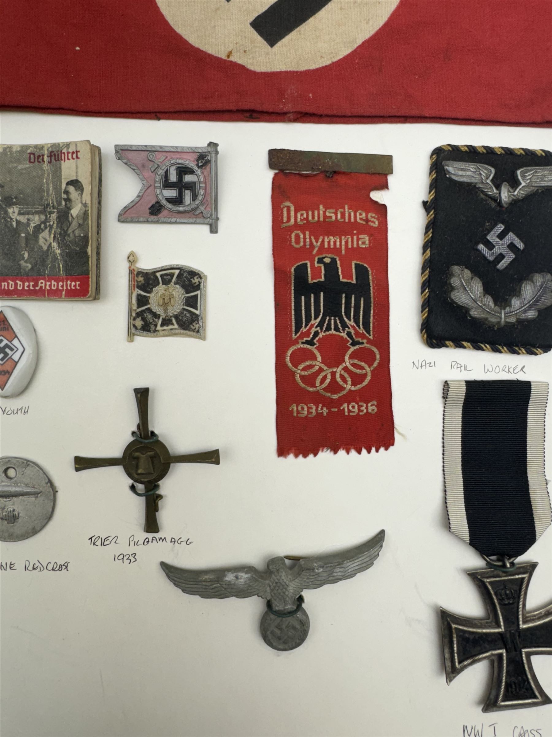 WWII Iron Cross, together with Hitler Youth pin, NSDAP arm band, Deutsches Olympia silk badge and other German insignias 