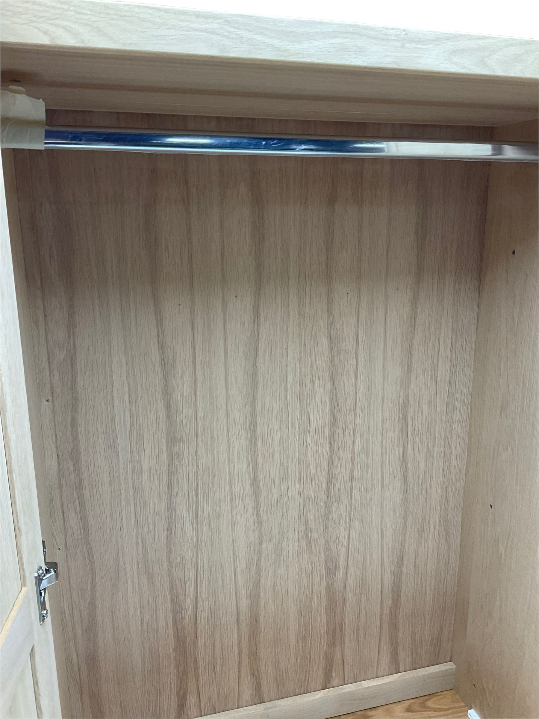 Corndell Furniture - light oak triple wardrobe, enclosed by three panelled doors, one long and one short drawer