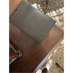 Early 19th century rosewood and brass inlaid tea caddy, of sarcophagus form, the front and hinged opening cover inlaid with brass scrolling panels, opening to reveal a compartmented interior with twin removable boxes with conforming inlaid brass detail to the hinged covers and zinc lining to the interiors, flanking a later glass mixing bowl, the whole upon four turned cylindrical feet, H21cm W36cm D20cm