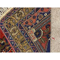 Turkish Taspinar rug, blue ground with central lozenge and medallion, the outer borders decorated with stylised motifs