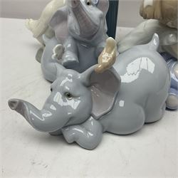 Two Lladro figures, Over the Threshold no 5282 and Prayful Moment no 5500 together with five Nao figures